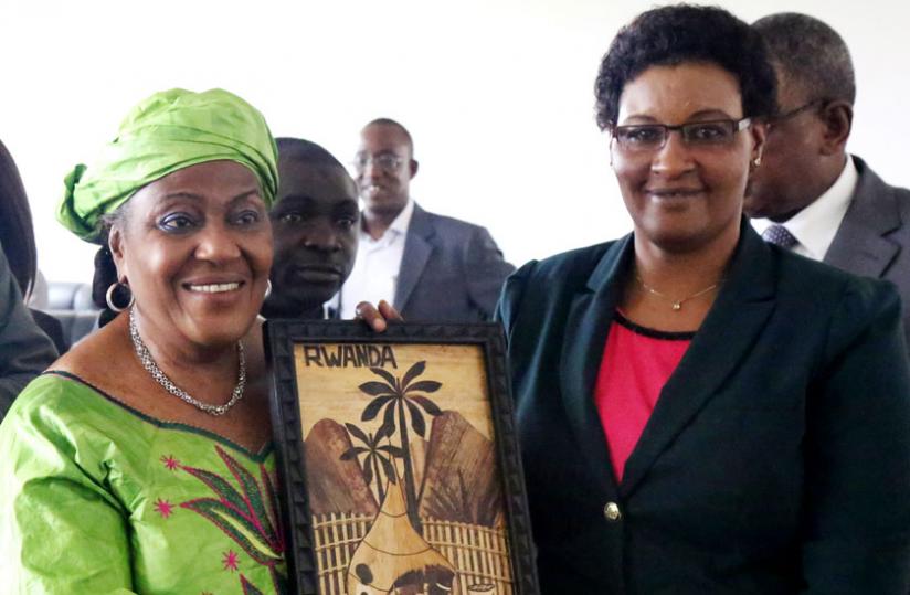 Speaker Donatille Mukabalisa (R) presents the Ivorian parliament vice-president, Sarah Sako Fadiga, with a gift after their meeting on Friday.(John Mbanda)