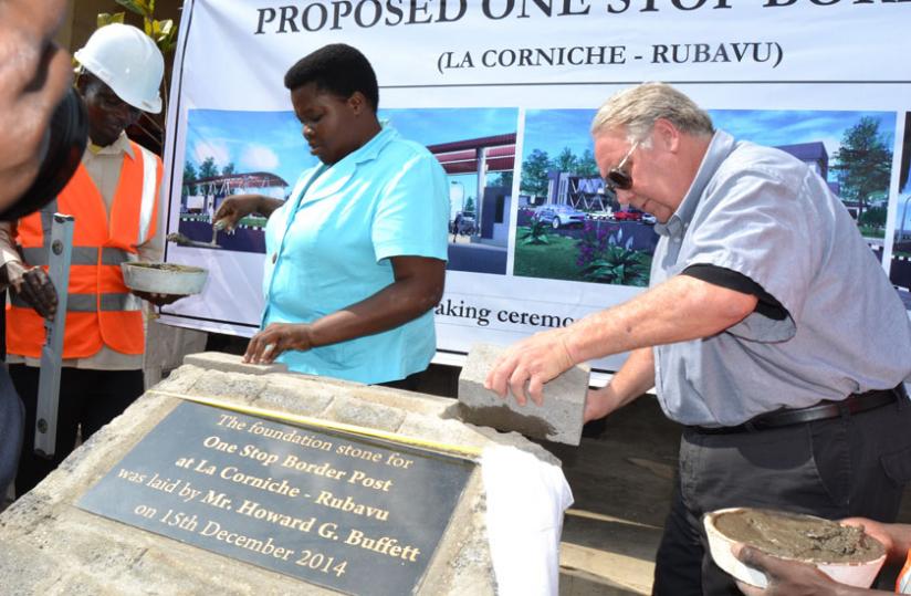 Howard Buffett (R) and Western Province governor Caritas Mukandasira lay a foundation stone where the one-stop border post will be constructed at u00e2u20acu02dcGrande Barriu00c3u00a8reu00e2u20acu2122 between Rubavu and Goma. (Jean du00e2u20acu2122Amour Mbonyinshuti)