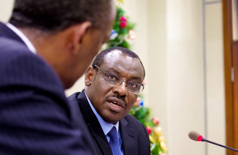 Minister Gatete speaks to Makonnen during the media briefing yesterday. (Timothy Kisambira)