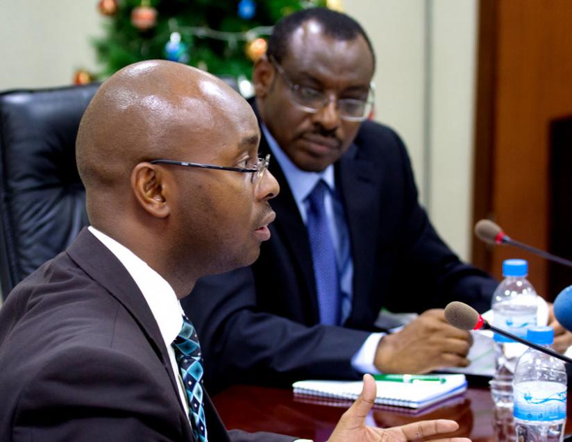Murangwa (L) addresses the media as Minister Gatete looks on. (Timothy Kisambira)