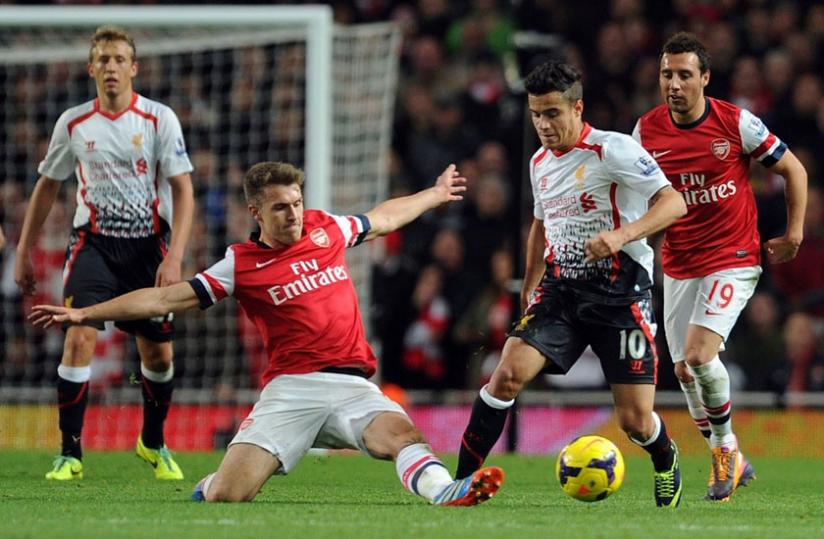 Phillipe Coutinho weaves his way past Arsenalu00e2u20acu2122s Aaron Ramsey in the 5-1 win at Emirates that is now a distant memory. (Net photo)