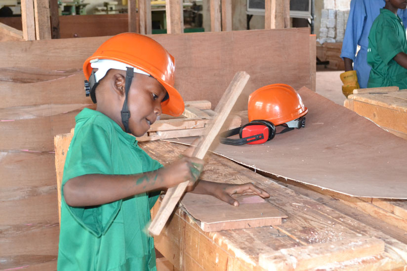 FUTURE CARPENTER: A 10-year-old boy doing his thing. (Stephen Rwembeho)