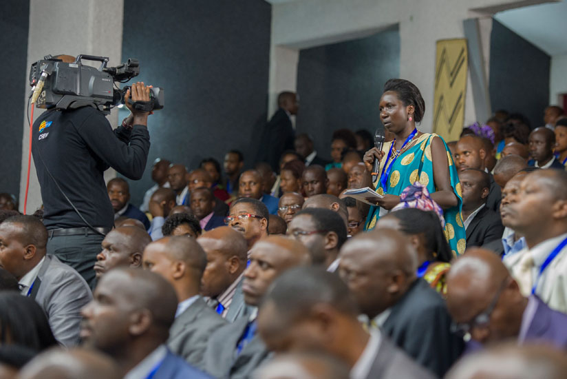 A delegate contributes to the debate during the 12th Umushyikirano. (Timothy Kisambira)