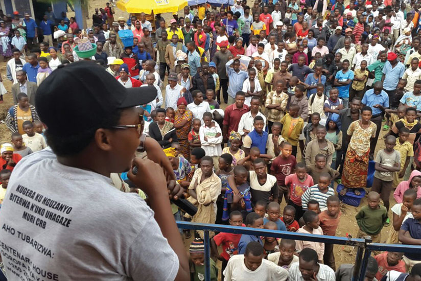 A CBR employee sensitises traders and other residents in Rwamagana District last week. CRB is carrying out a drive to educate borrowers.   (Solomon Asaba)