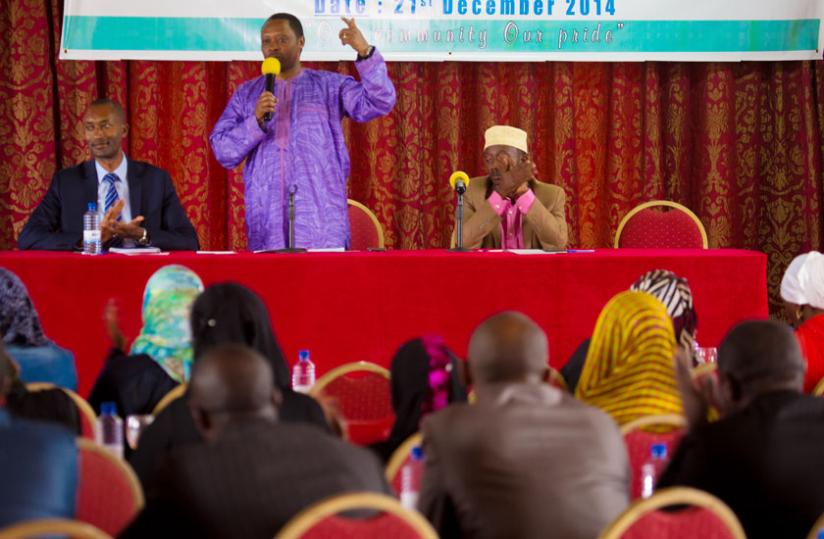 Anastase Shyaka, the CEO of Rwanda Governance Board (C) addresses the gathering as Dr Rajab Mugabo, president of the Network of Muslim Professionals (L), and Mufti of Rwanda, Ibrahim Kayitare(R ), look on. (Timothy Kisambira)