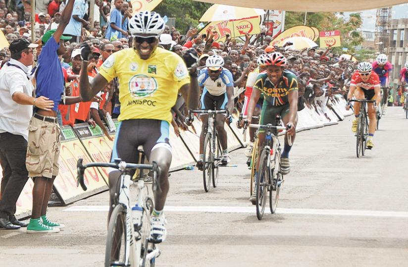 Valens Ndayisenga celebrates as he crosses the finish line on his way to claiming the 2014 Tour du Rwanda race last month.  (T. Kisambira)