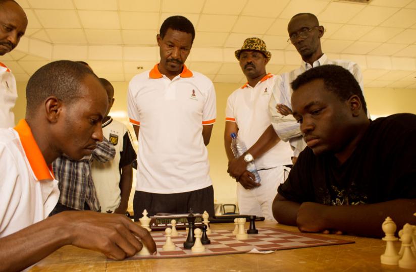 Ben Zimurinda, handed Kabera, right, his only loss in six-round tourney. (Fernand Mugisha)