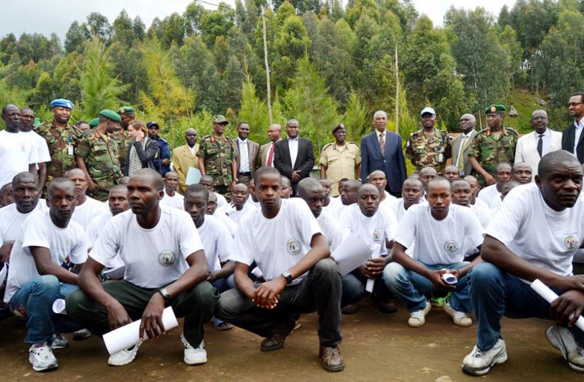 Some of the discharged ex-FDLR combatants and security officials pose in a group photo. (Jean Mbonyinshuti)