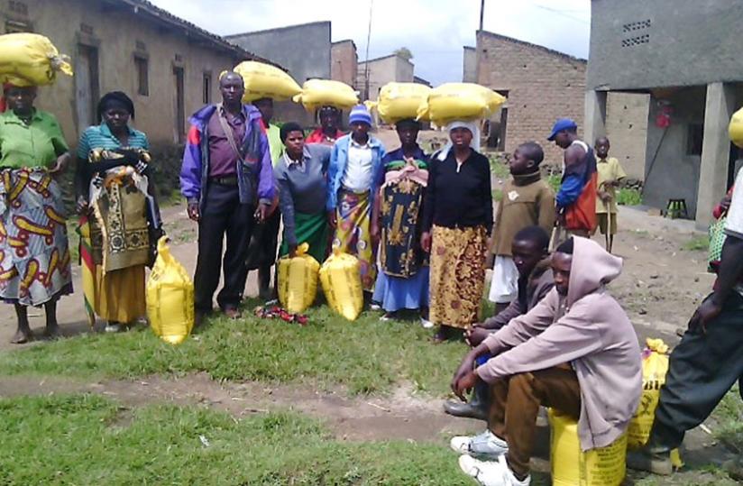 Residents of Nkotsi Sector in Musanze after sharing rice for the festive season. (Jean d'Amour Mbonyinshuti)