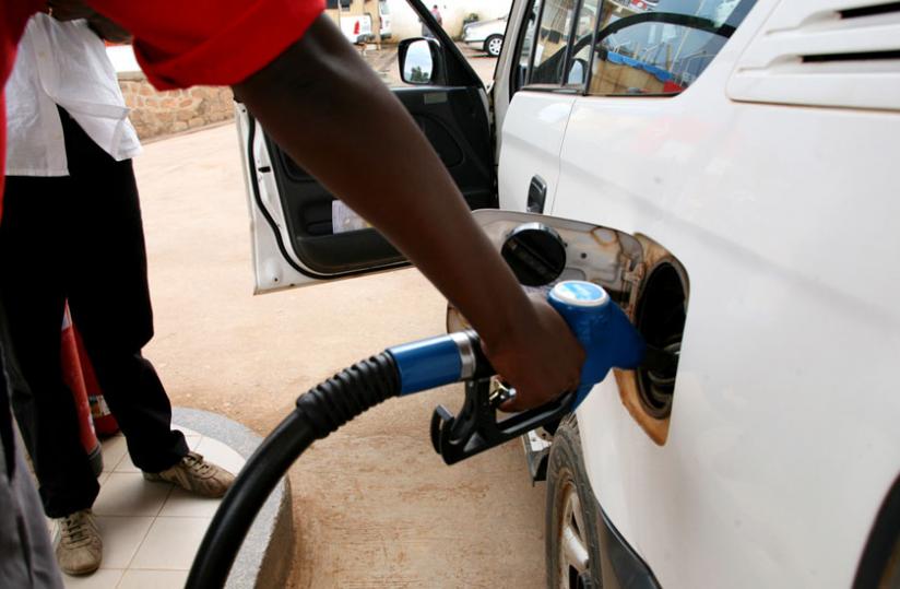 A pump attendant fuels a car in Nyabugogo. (File)