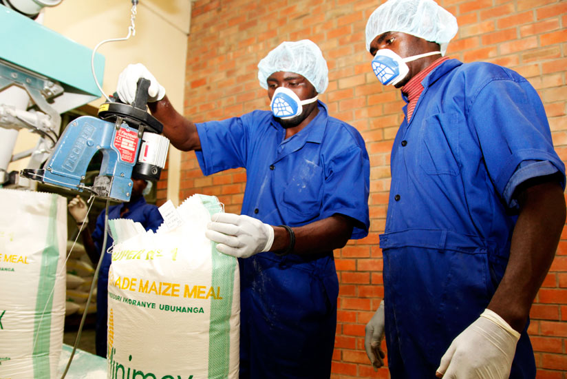Workers at Minimex Maize Millers packages flour. (File)
