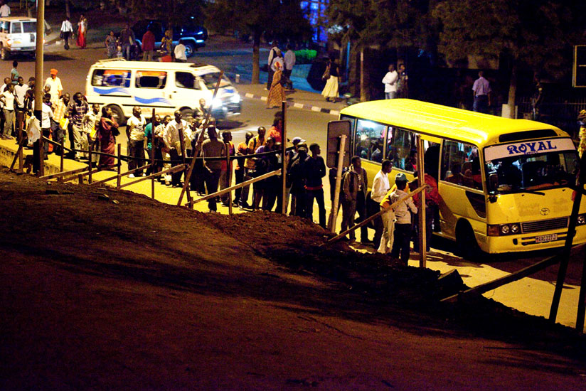 Passengers queue to board an omnibus at Statistic Bus Stop in downtown Kigali. (File)