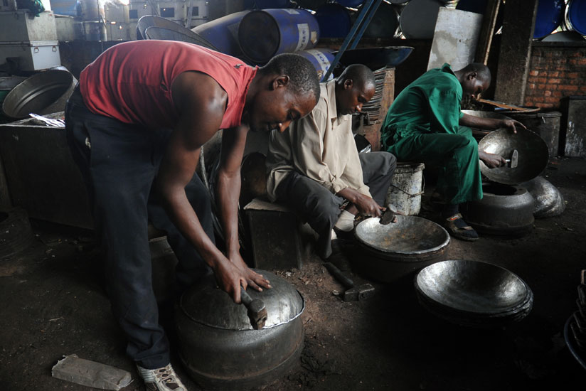 Fabricating basins from scrap metal. (John Mbanda)