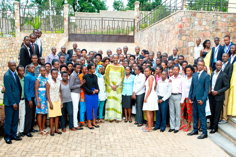 First Lady Jeannette Kagame (C) in a group photo with youth orphaned by the 1994 Genocide against the Tutsi and members of the Association of Student Survivors of the Genocide yesterday. (Village Urugwiro)