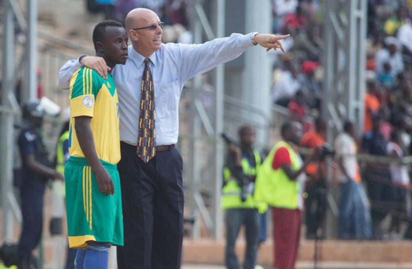 Constantine gives instructions to midfielder Robert Ndatimana during Amavubi's friendly game against Burundi last week. (T. Kisambira)
