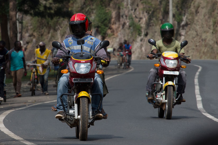 Motocyclists ferry passengers from Nyabugogo to Jabana yesterday. (T. Kisambira)