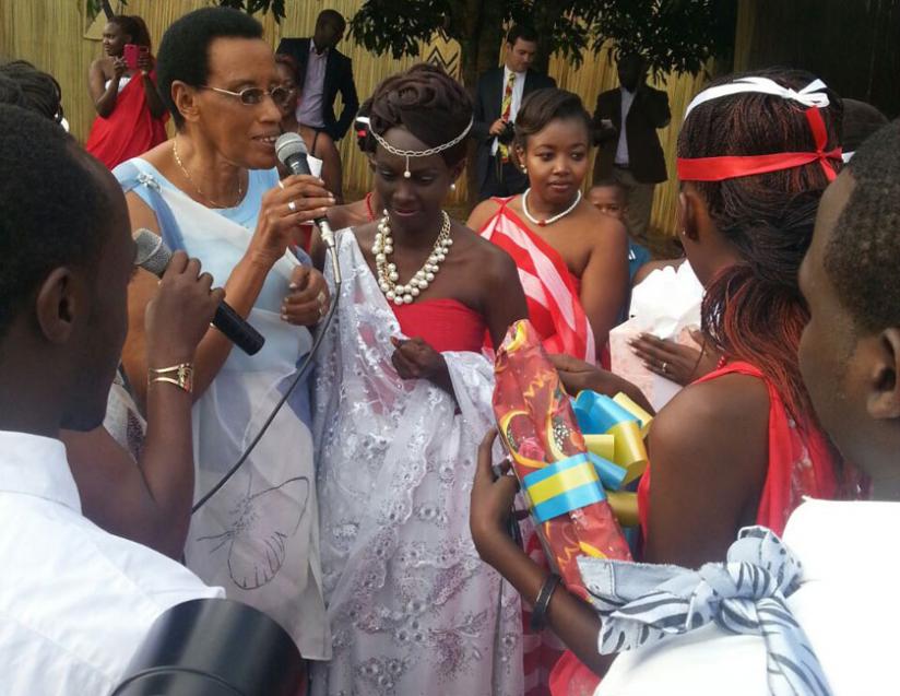 Folk music icon, Maria Yohana Mukankuranga sings to the bride.  