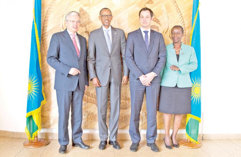 President Paul Kagame poses with Alexander De Croo, the Belgian development cooperation minister (2nd R), and foreign ministers Didier Reynders (L) and Louise Mushikiwabo of Belgium and Rwanda, respectively, at Village Urugwiro yesterday. (Village Urugwiro)