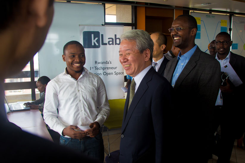Jica President Dr Akihiko Tunaka shares a light moment at K-Lab. (Timothy Kisambira)