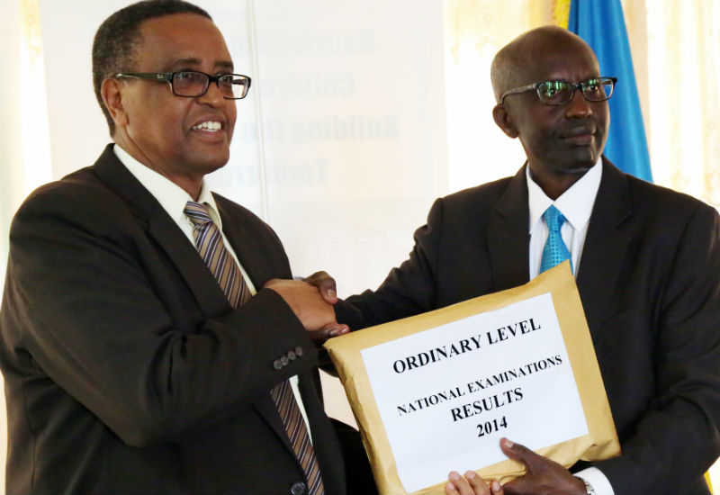 Rwanda Education Board head. John Rutayisire hands over the O-level results to education minister, Prof. Lwakabamba. J.Mbanda