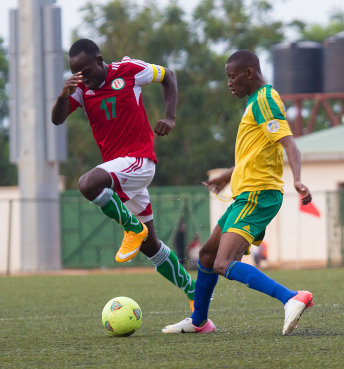 Amavubi midfielder, Jean Baptiste Mugiraneza (R), tries to stop Burundi skipper Cu00e9dric Amissi during last month's friendly.  Rwanda is likely to face S. Africa in two friendlies. (T. Kisambira)