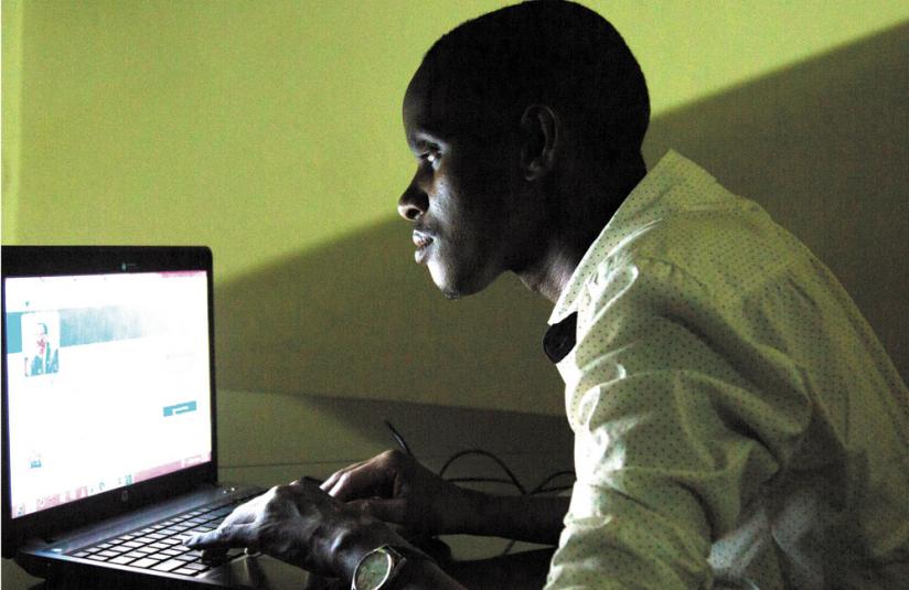 A young man surfs the internet. Social media platforms such as Facebook and WhatsApp are being used to market pornography. (File)