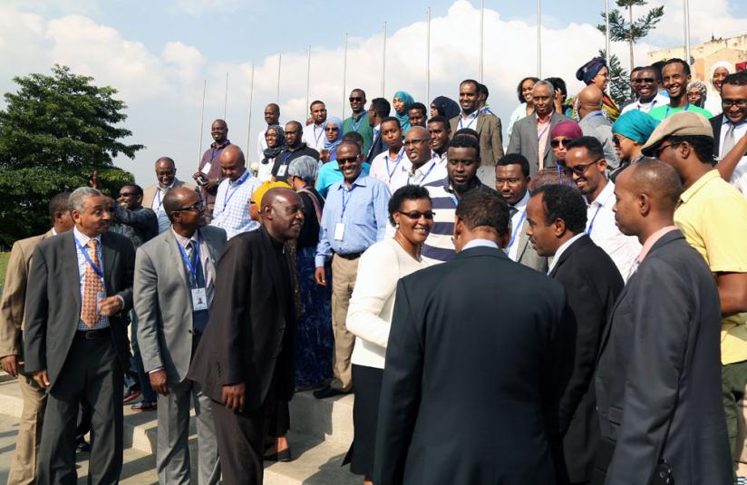 Mukabalisa (centre) with the Somali delegation at Parliament yesterday. (John Mbanda)