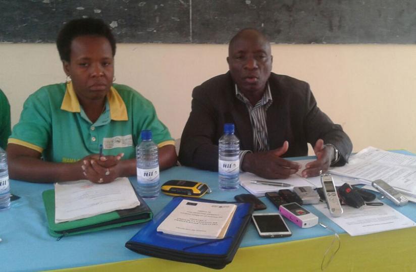 Bicamumpaka (right) addresses journalists at a news briefing on Tuesday. (Edwin Musoni)