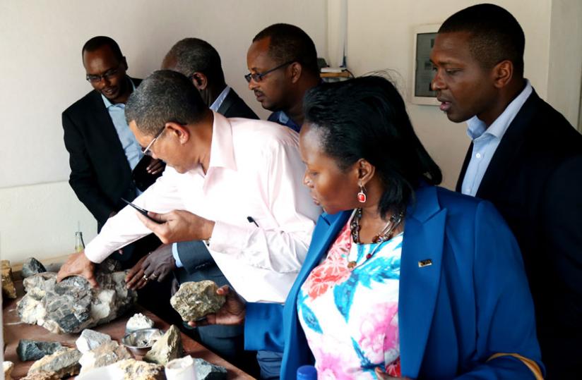 The Lawmakers examine an assortment of mineral stones mined in Rutongo mines in Rulindo District yesterday. (John Mbanda)