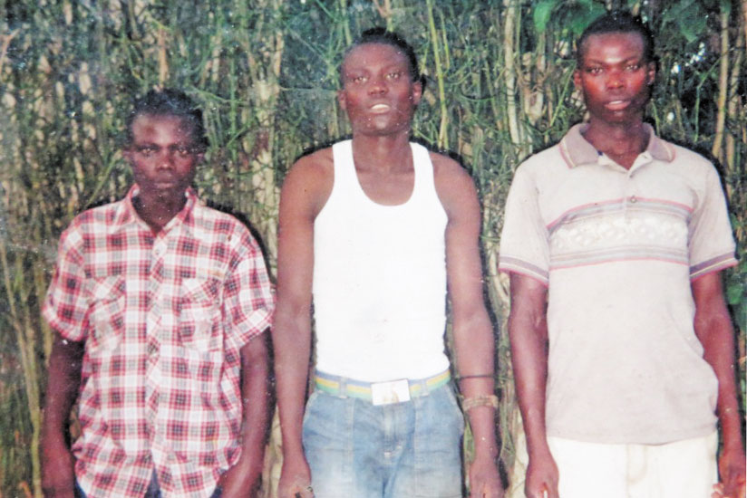 Ntahondi (right), the husband of Uwimana with his two younger brothers. 