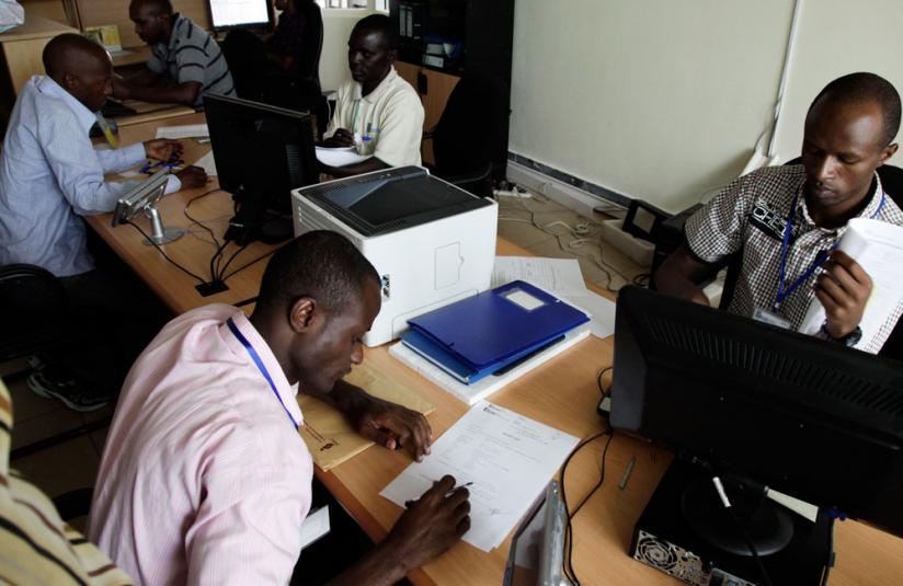 People register businesses at Rwanda Development Board recently.  (T. Kisambira)