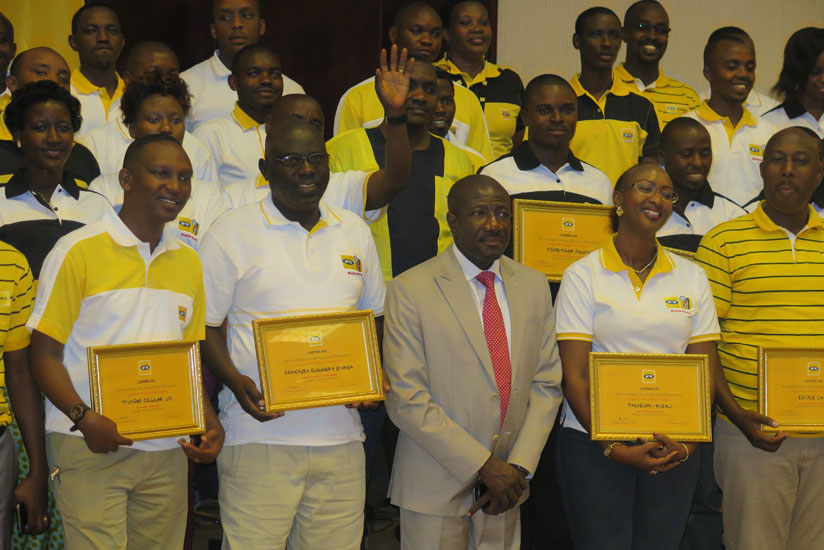 Some of the retailers pose for a picture with MTN chief executive officer Ebenezer Asante on Friday. (Ben Gasore)