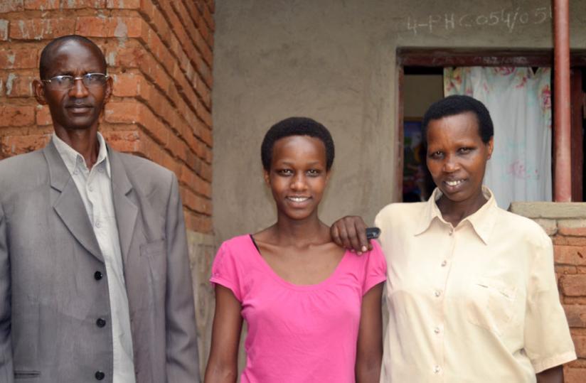 Mugwaneza and her parents pose for a photo shortly after the interview. (Jean d'Amour Mbonyinshuti)