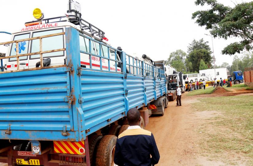An ambulance and other equipment loaded on a truck at Kanombe Military Barracks prepare to depart for Central African Republic yesterday. (John Mbanda)