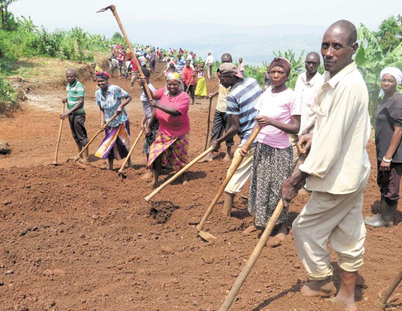 Rutunga residents clear a street under the VUP framework. VUP uses  public works as a means to support needy people. (E. Ntirenganya)