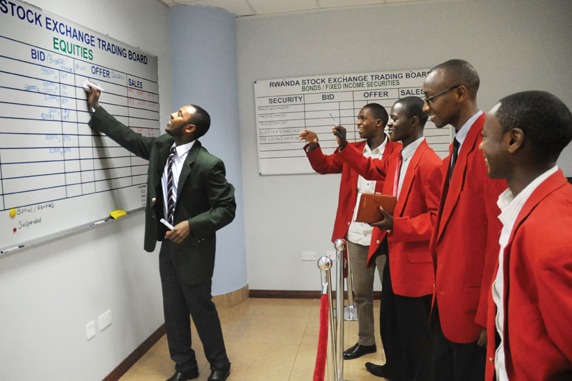 Stock brokers during a trading session at the local bourse. RSE performed poorly in 2014. 