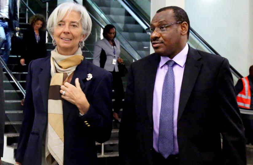 IMF chief Christine Lagarde chats with Finance and Economic Planning minister Claver Gatete on her arrival at Kigali International Airport yesterday.(John Mbanda)