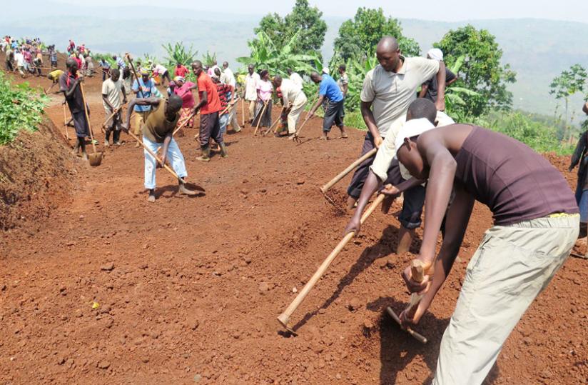 Residents of Rutunga in Gasabo District build a new road under the VUP programme. (File)