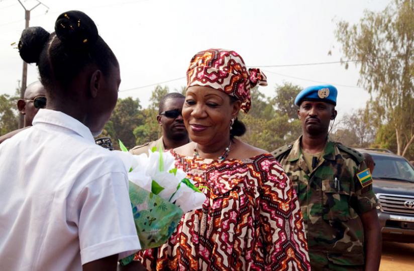 President Samba-Panza at a function being guarded by an RDF peacekeeper (in background). (T. Kisambira)