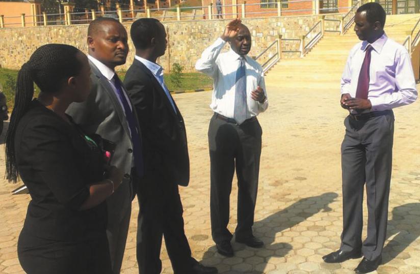 Mutazihana (second right) chats with Kanyankole (third left) and other BRD officials after touring Kigali Parents projects. (P. Tumwebaze)