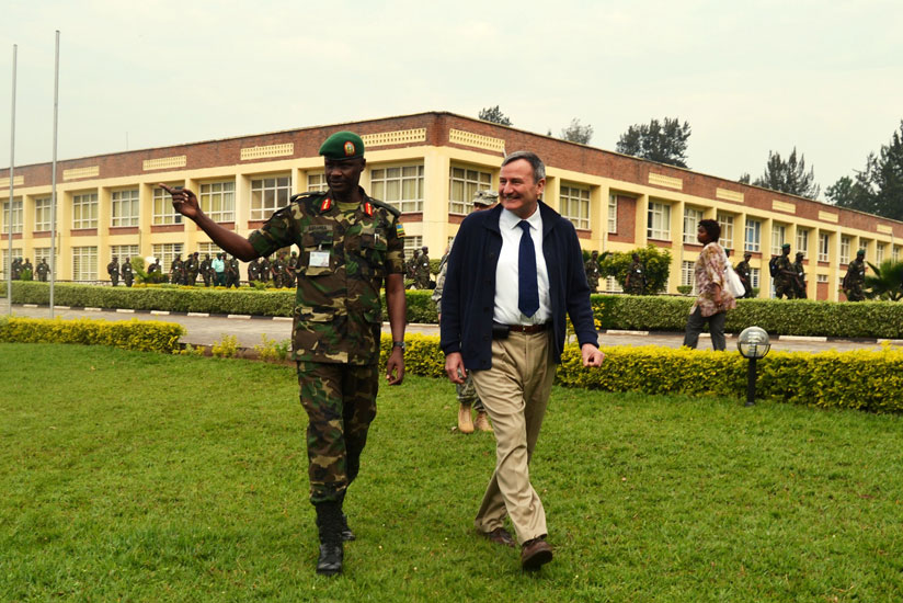 Brig. Gen. Charles Karamba, Commandant, RDF Command and Staff College, Nyakinama, takes Rtd. Lt. Gen. Eikenberry on a guided tour  of the college premises on Thursday. (Jean d'Amour Mbonyinshuti)