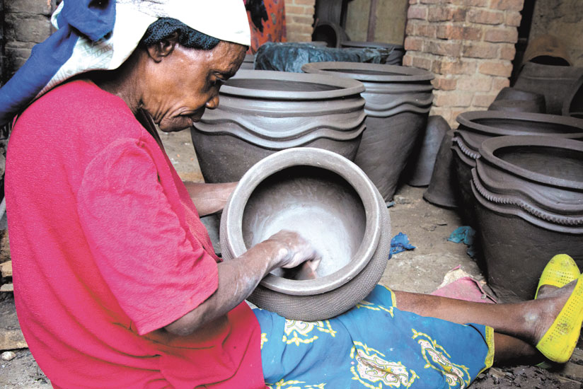 Working under a cooperative helps potters get good prices. (Timothy Kisambira)