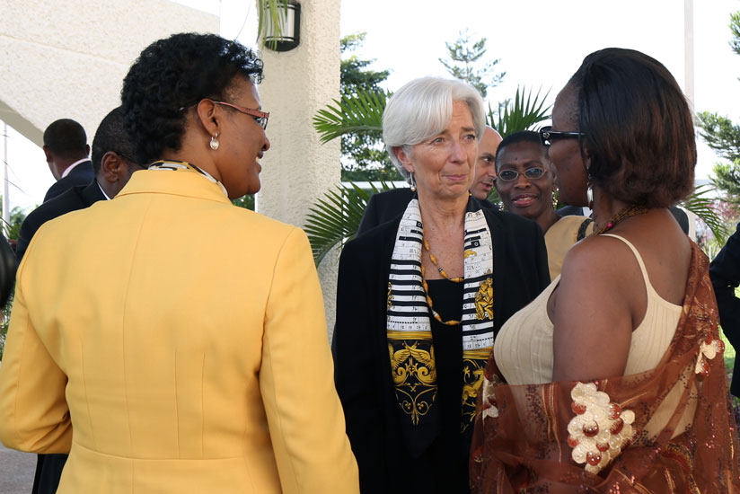 Christine Lagarde (C) talks to MP Constance Rwaka (R) and the Speaker Donatille Mukabalisa at Parliament. (John Mbanda)