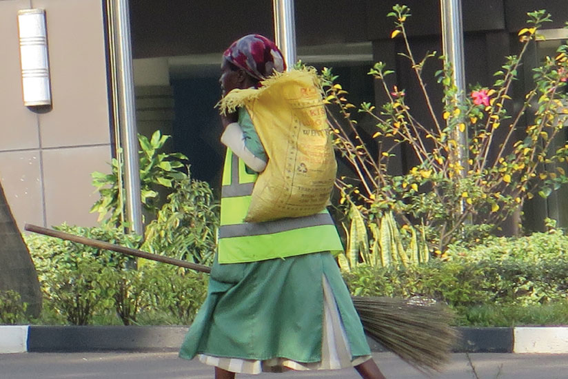 A street cleaner along the Kigali International Airport Road yesterday. The cleaning services industry has come a long way. Though the sector is slowly making a mark on the economy it faces some bottlenecks. (Donah Mbabazi)