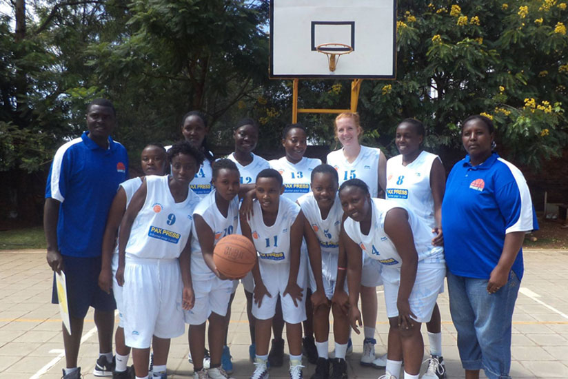 Coach Jacques Bahige (L) with  Ubumwe basketball club players. (R.Bishumba)