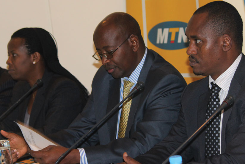 L-R: Minister of State for Energy Germaine Kamayirase, Musoni and  Sano at the launch of the e-payment system. (Clement Uwiringimana)