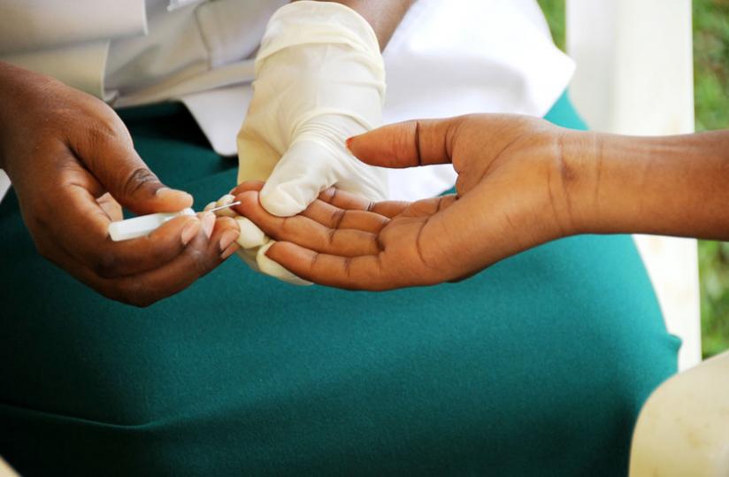 A woman tests for HIV at King Faisal Hospital, Kigali. Rwandan researchers, in a partnership with US scientists, have developed a low-cost smartphone accessory that can detect HIV and syphilis from a finger prick of blood in just 15 minutes. (File)