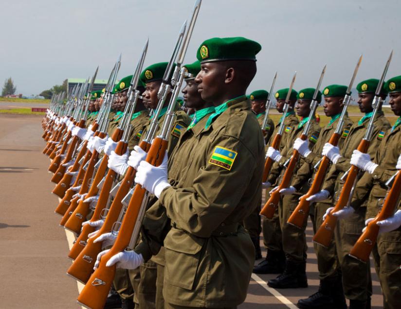 RDF soldiers mount a parade at Kigali International Airport on October 28, 2013. (Timothy Kisambira)
