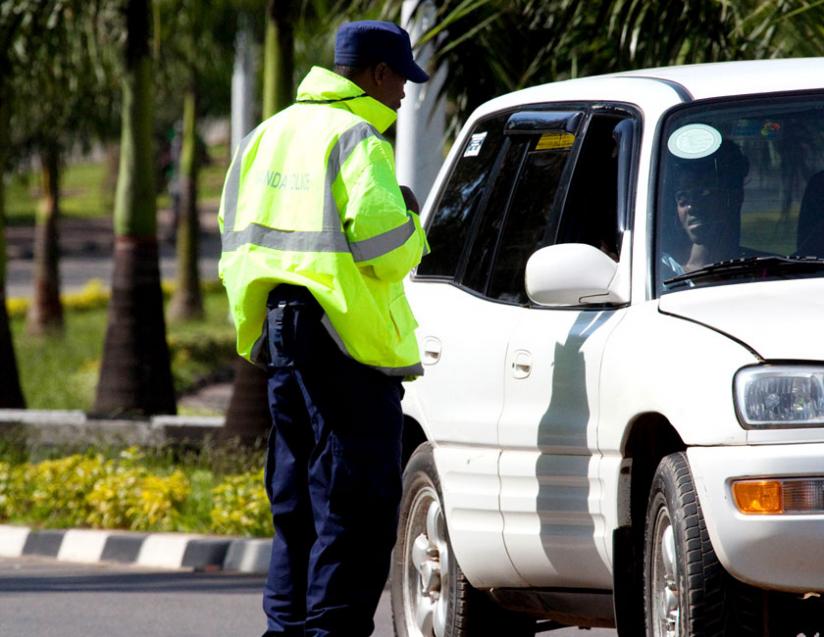 A Traffic Police officer talks to a motorist in Kigali. Rwanda National Police has intensified efforts to wipe out bribery in the Force. (File)