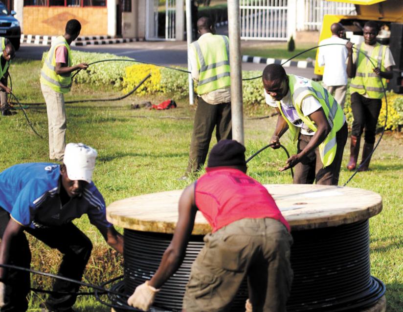 Workers lay fibre optic cables in Kimihurura, Kigali. Affordable internet is key for development. (File)